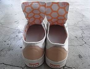 Shoes featuring a repeating pattern of hexagonal shapes on the inner lining of the shoe uppers.